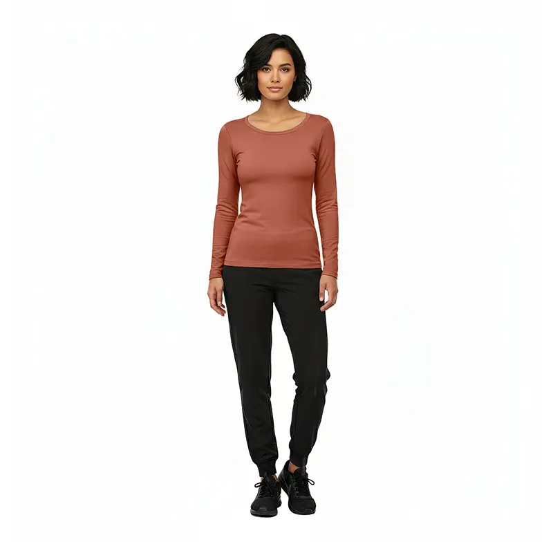 Wholesale women's terracotta long-sleeve crew neck top with black jogger pants and black lace-up shoes