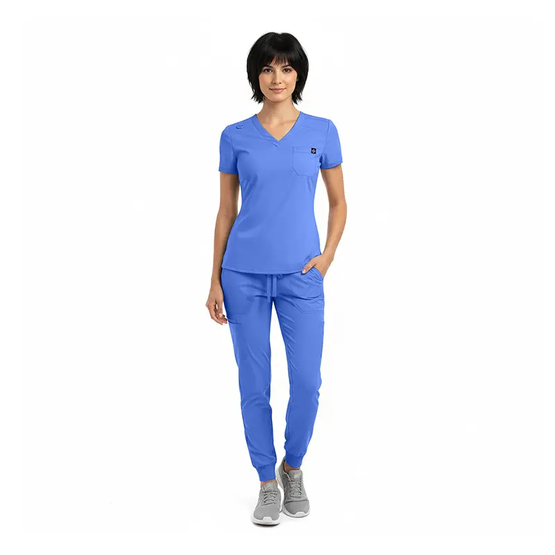 Wholesale women's blue v-neck scrub top with short sleeves and matching jogger pants with gray sneakers