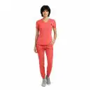 Wholesale women's coral scrubs set with v-neck top and jogger pants with gray sneakers