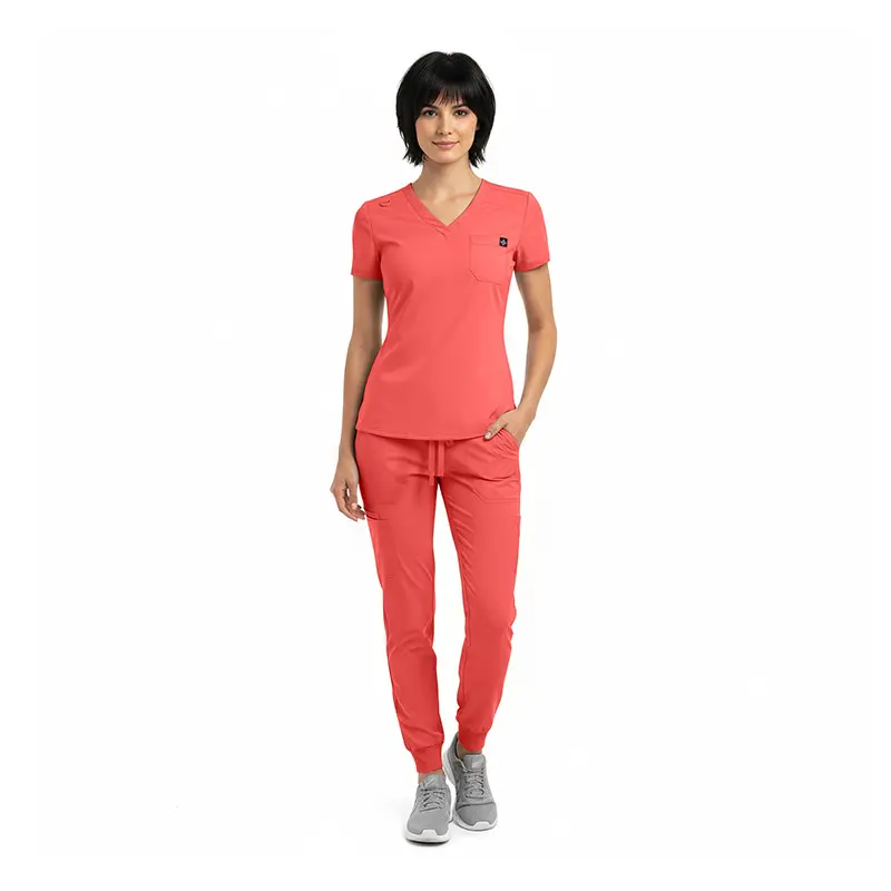 Wholesale women's coral scrubs set with v-neck top and jogger pants with gray sneakers