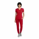 Wholesale women's red v-neck scrub top with short sleeves and matching red jogger pants with gray sneakers