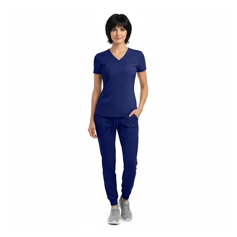 Wholesale women's navy blue v-neck scrub top with short sleeves and matching jogger pants with gray sneakers