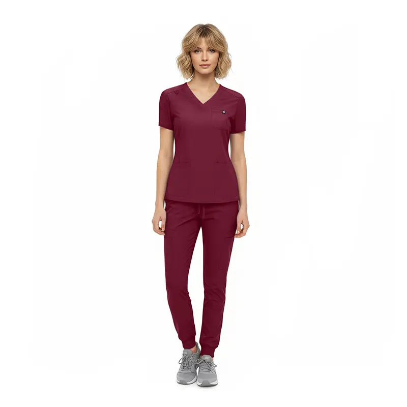 Wholesale women's burgundy v-neck scrub top and jogger pants set with gray sneakers