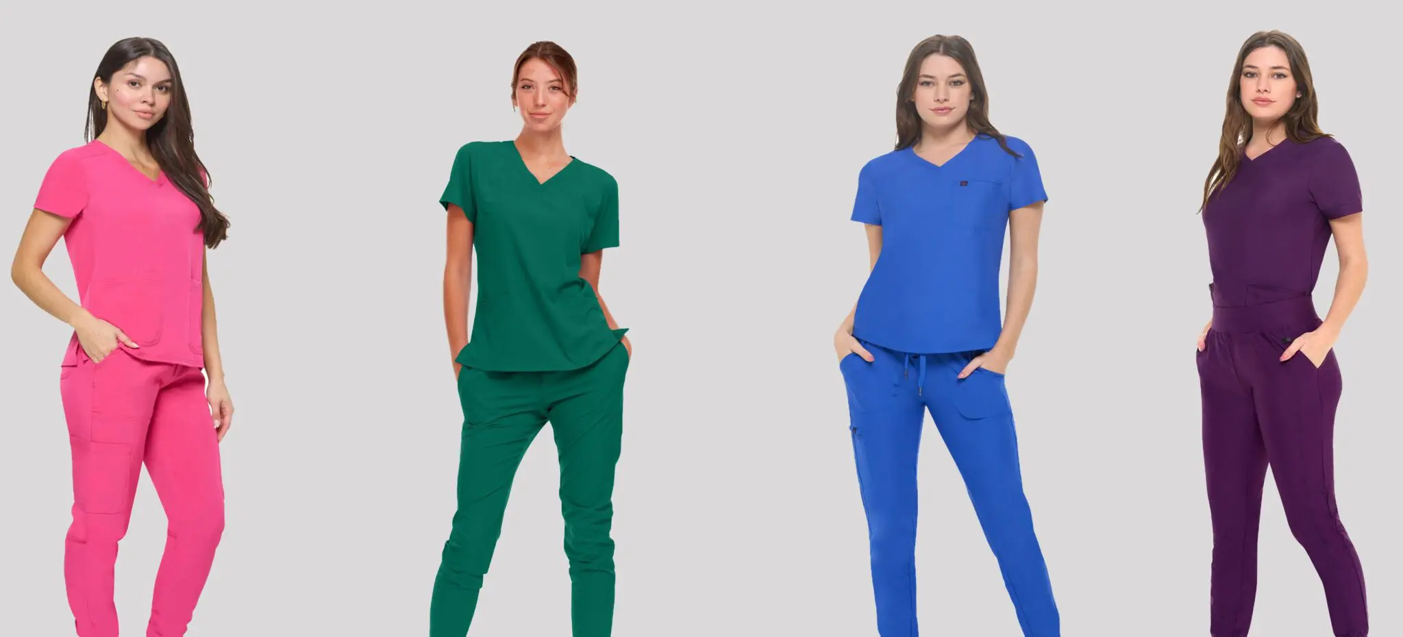 Wholesale women's scrub sets in pink, green, blue, and purple with v-neck tops and matching pants