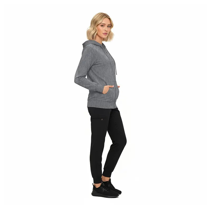 Wholesale women's gray zip-up hoodie with kangaroo pockets paired with black joggers and black sneakers