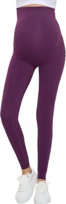 Wholesale women's maternity leggings in purple with high waistband, shown with white sneakers